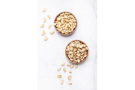 Cashew and pistachios nuts in bowls, a Food & Drink Photo by MAnuta