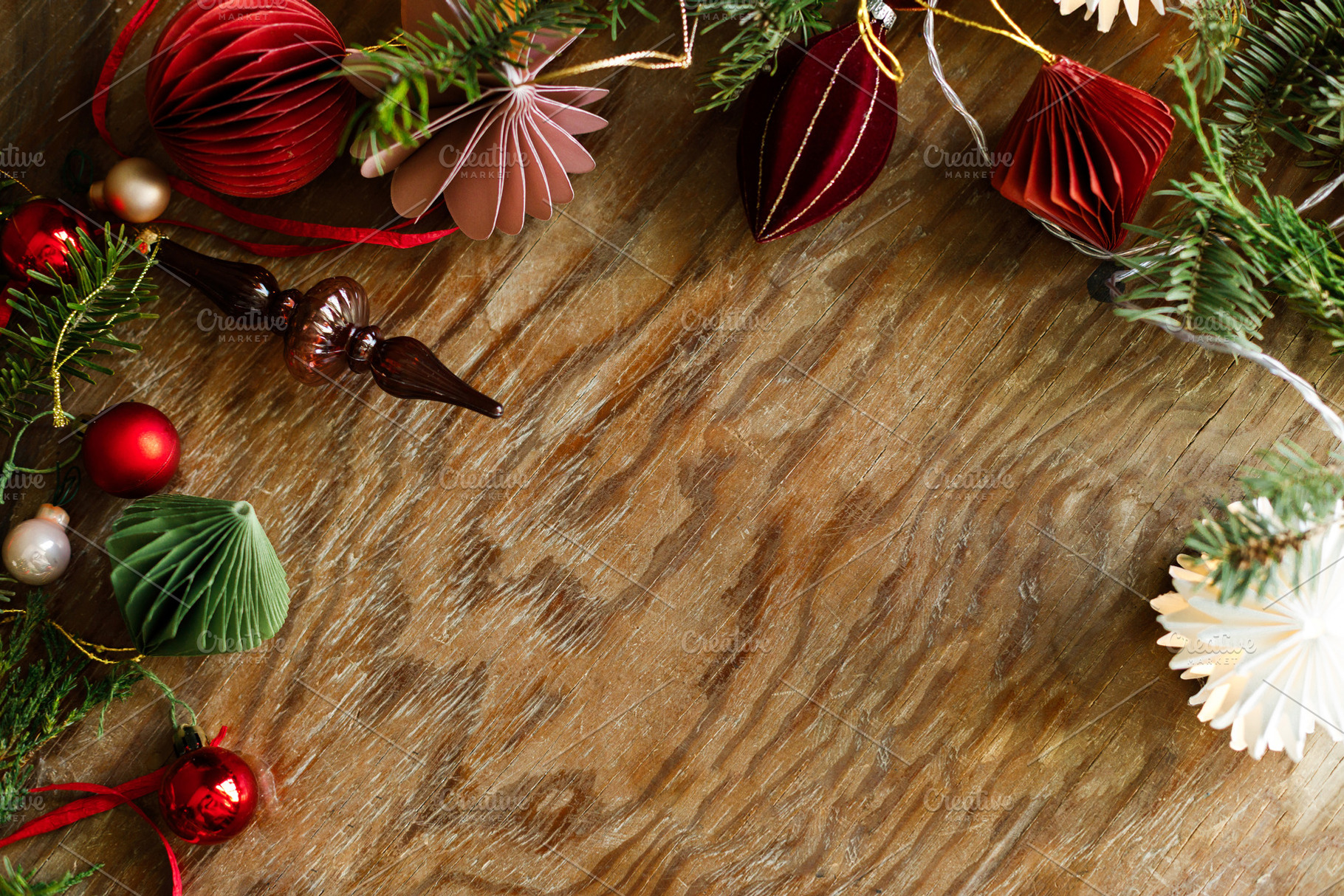 Christmas festive top border of paper garland, red baubles, orna, a Photo by Sonjachni