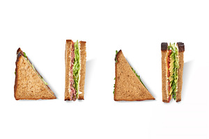 Cut club sandwich made with ham, a Food & Drink Photo by Yaroslav Danylchenko
