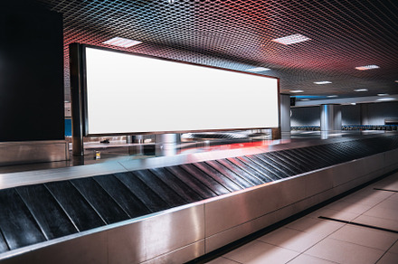 Blank billboard at the baggage claim, a Transportation Photo by SkyNext