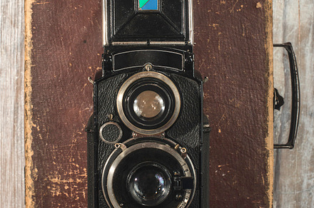 Vintage photo camera on wooden backg featuring camera, vintage, and white, an Industrial Photo by Deyan Georgiev