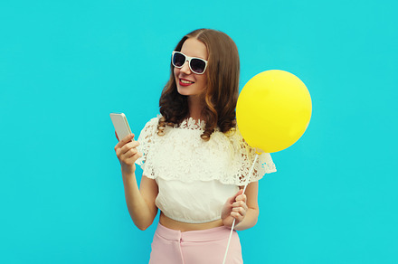 woman with phone holding balloon, a Person Photo by Rohappy