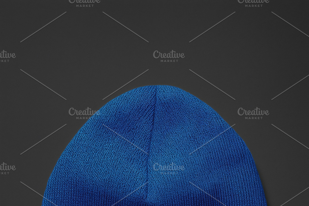 A blue knit beanie hat mockup on a dark background, a Hat Mockup by Textures & Backgrounds
