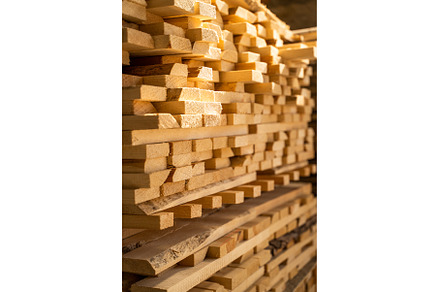 Stacked wooden planks in close-up at, an Industrial Photo by volodymyrshtun13795