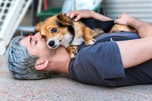 Hug of a man and his dog.