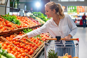 Woman Choosing Fresh Tomatoes in Supermarket, a Food & Drink Photo by Davizro's Market