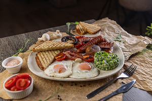 English breakfast served on restaurant table, a Photo by Grafvision photography