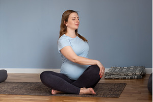 Pregnant caucasian woman sitting on