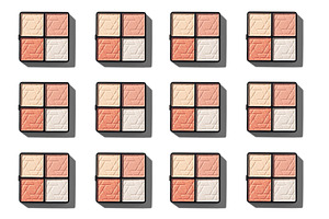 A flat lay of multiple eyeshadow palettes on a white background.