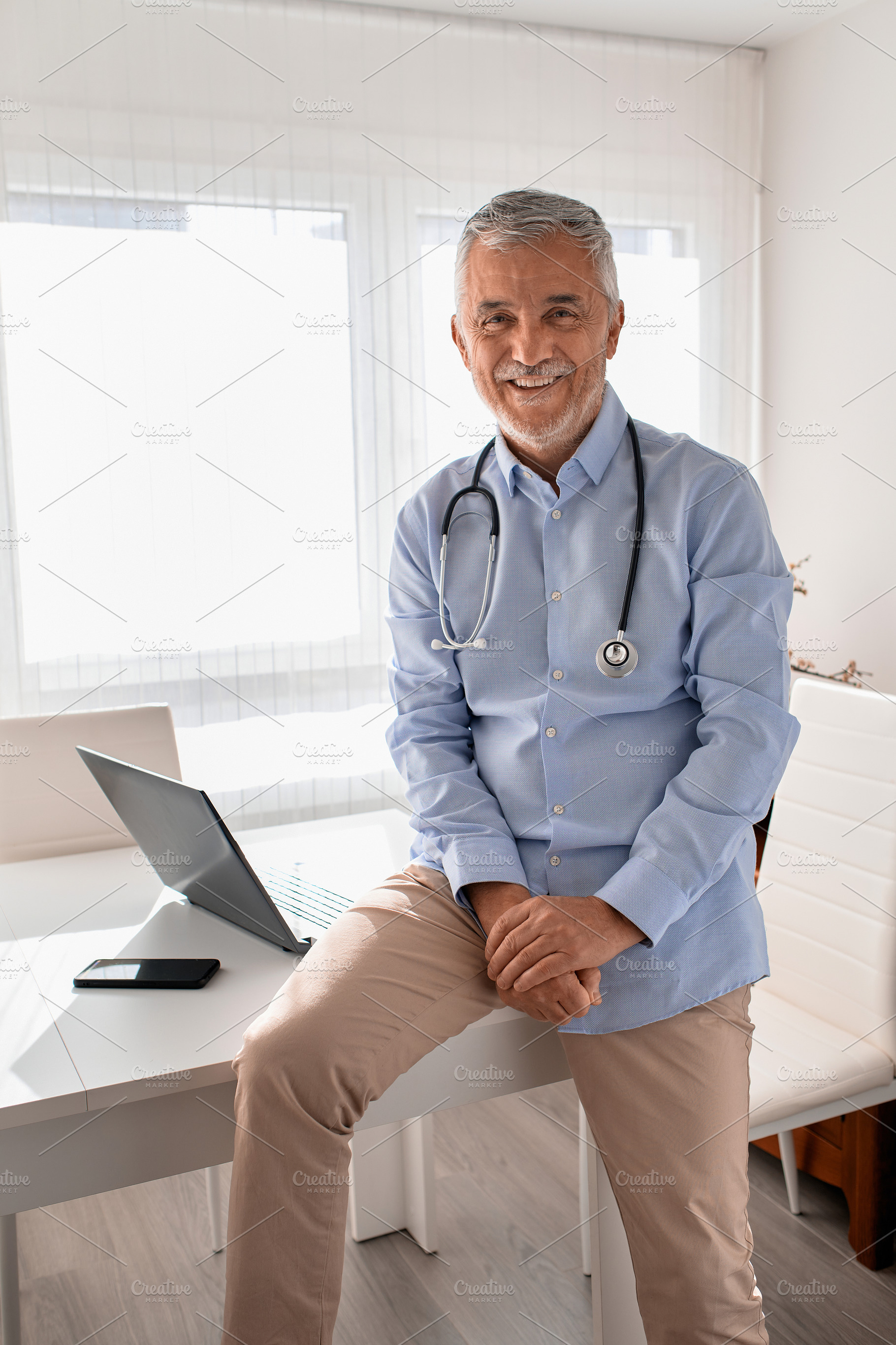 Portrait of mature doctor smiling an, a Person Photo by alfernec