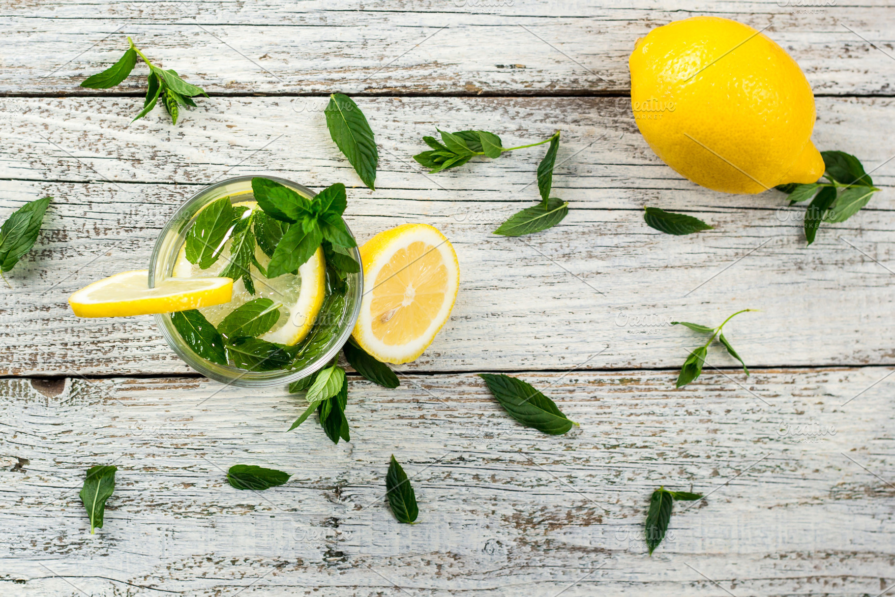 Water with lemon and mint in a glass stock photo containing drink and glass, a Food & Drink Photo by dashtik