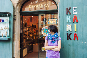 Woman in front of ceramics shop, a Person Photo by BOOCYS