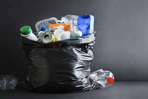Garbage bag full of general waste on a dark background, a Nature Photo by Davizro's Market