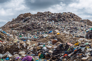 Large landfill overflowing, a Photo by Pavel_design