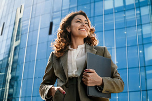 Confident Executive Walking Outside Corporate Building, a Business Photo by Davizro's Market