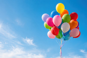 Colorful balloons floating in sky, a Photo by Beautiful things