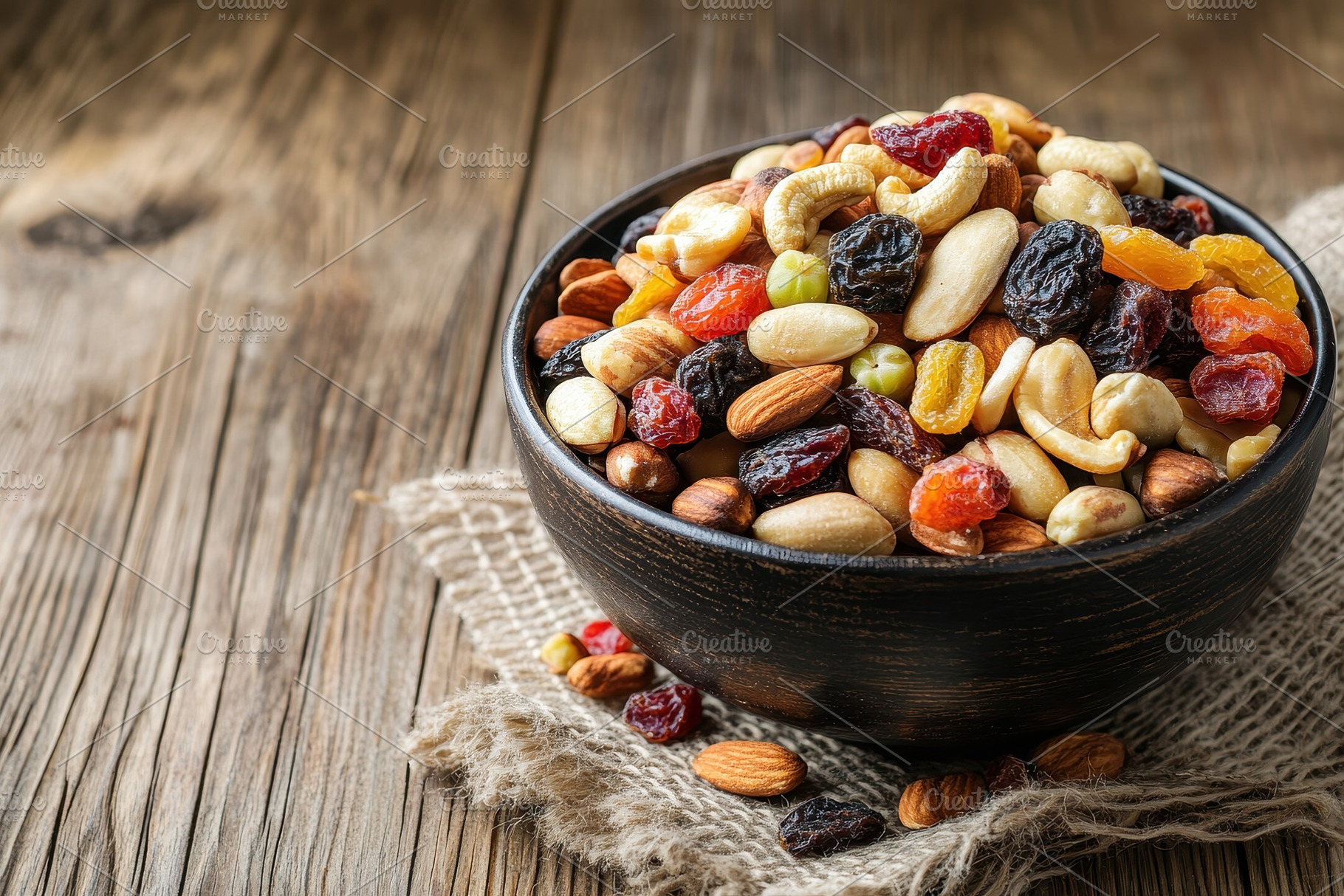 Bowl of mixed nuts and dried fruits, a Photo by Pavel_design
