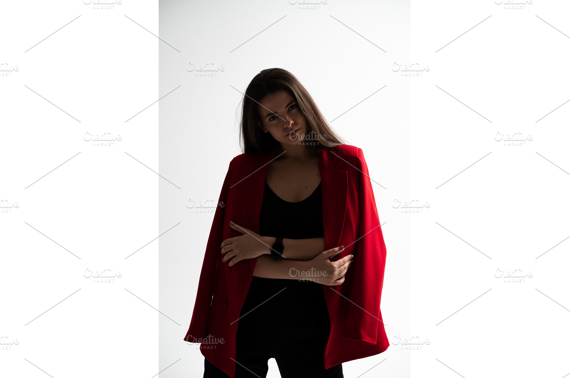 Confident young woman in a red, a Person Photo by volodymyrshtun13795
