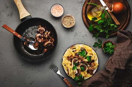 Tasty tagliatelle pasta with mushrooms served on plate with pars, a Food & Drink Photo by 5PH