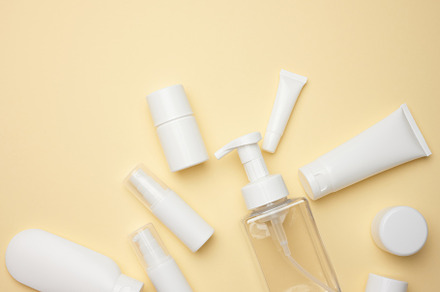 top view of white cream tubes, cosmetic dispenser, empty jars an, a Beauty & Fashion Photo by ndanko