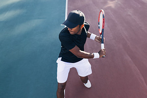High-angle view of a tennis player, a Sports & Recreation Photo by Artem Varnitsin