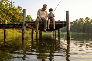 Grandfather and Boy Fishing on a Wooden Dock, a Sports & Recreation Photo by Davizro's Market