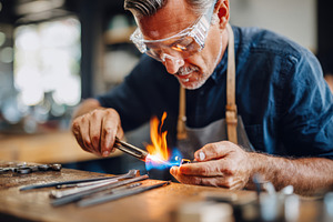 Craftsman Using Blowtorch in Workshop, a Person Photo by AlyaAnd