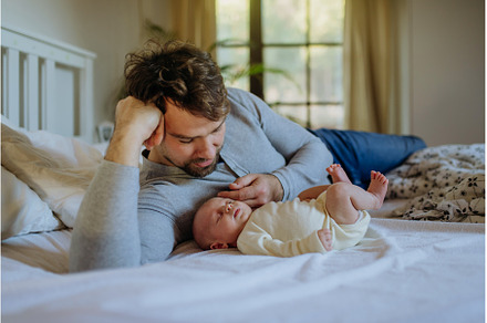 Close-up of father cudddling his, a Person Photo by HalfPoint