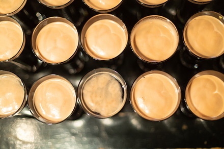 Beer glasses with dark beer are on t containing beer, glass, and alcohol, a Food & Drink Photo by oleghz