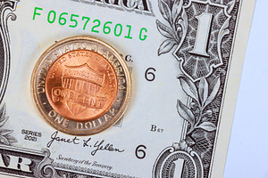 Mixed currency one dollar bill, one