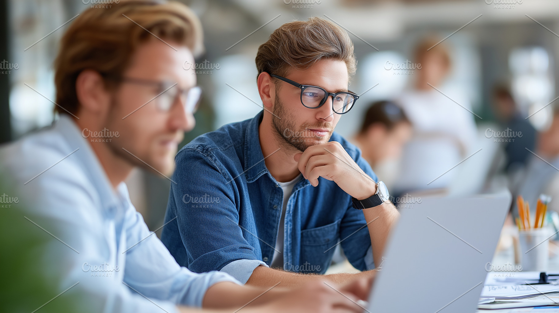 Two young men in glasses working, a Business Photo by MistyDay