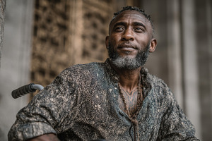 Portrait of black man in casual wear in an urban outdoor location, a Photo by AS photostudio