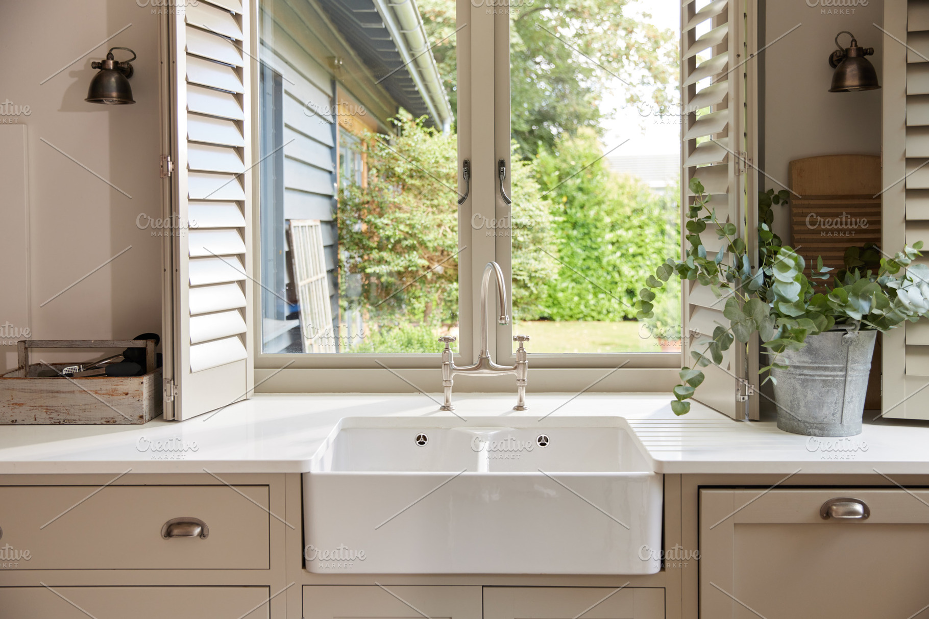 Domestic kitchen with clean sink and countertop, a Person Photo by Southworks