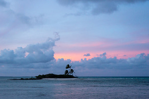 Sunset over a tropical motu on Tikehau Atoll, French Polynesia, a Nature Photo by GoodGoods