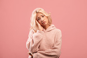 Bored young woman feeling upset and depressed, looking at camera, posing over p, a Photo by Prostock-Studio (Thumbnail 2 of 2)