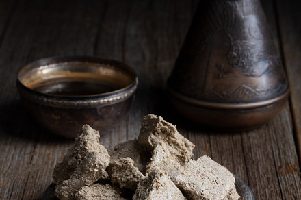 Vegetable-based halva sweet prepared from seeds on wooden background, a Food & Drink Photo by zakiroff