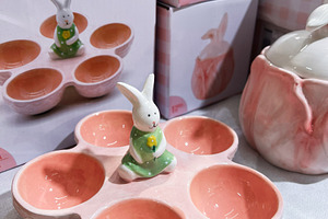 Ceramic bunny-themed serving dish in pink color with adorable design, a Photo by AS photostudio