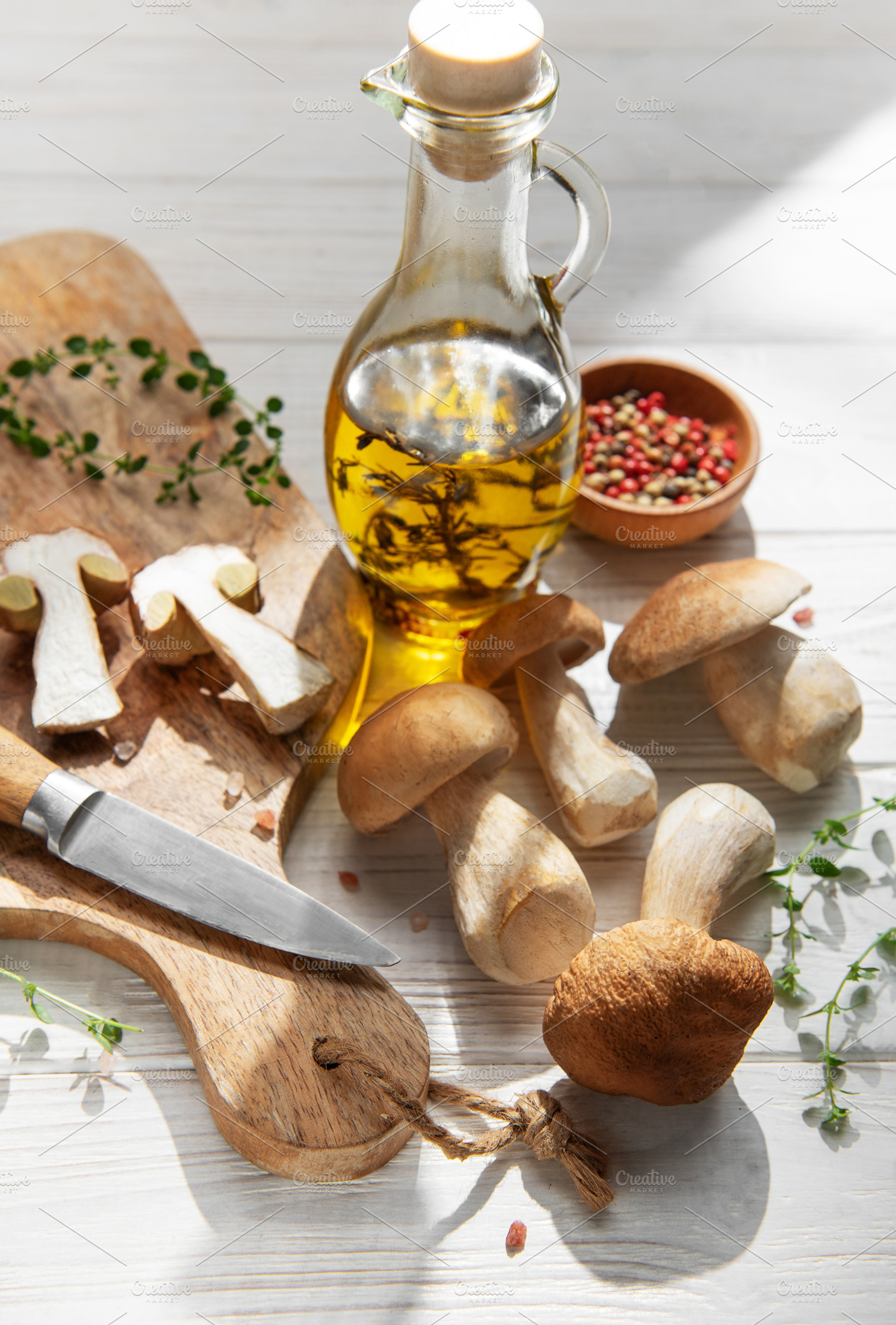 Preparing porcini mushrooms with olive oil and herbs, a Food & Drink Photo by Olena Rudo