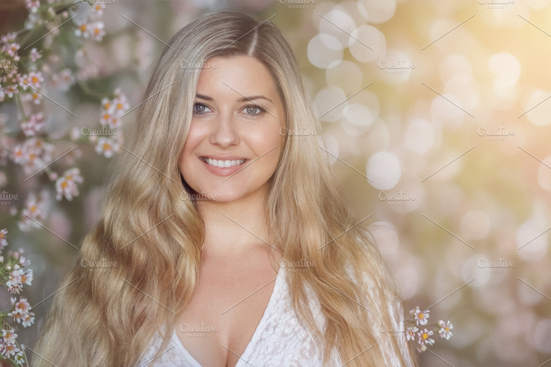 Blonde woman smiling in a natural setting, her long hair flowing, a Person Photo by Studio ANNA