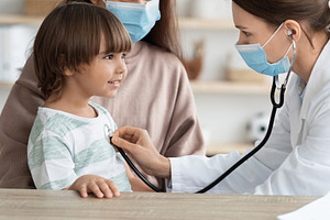Medicine and kids healthcare concept. Professional pediatrician examining littl, a Photo by Prostock-Studio