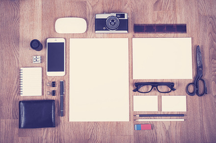 Top view office desk containing photography, keyboard, and stationery, a Business Photo by Twin Design