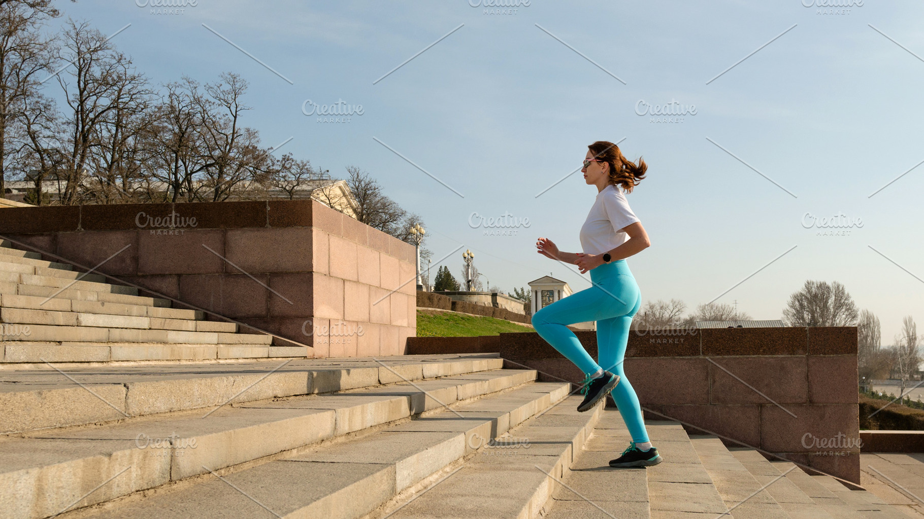 Young woman running on city streets, a Sports & Recreation Photo by Elena Vagengeim