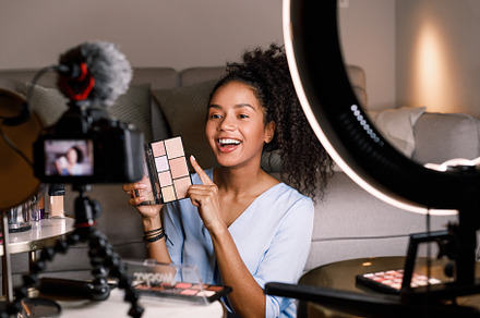 Laughing female holding an eyeshadow, a Person Photo by Artem Varnitsin