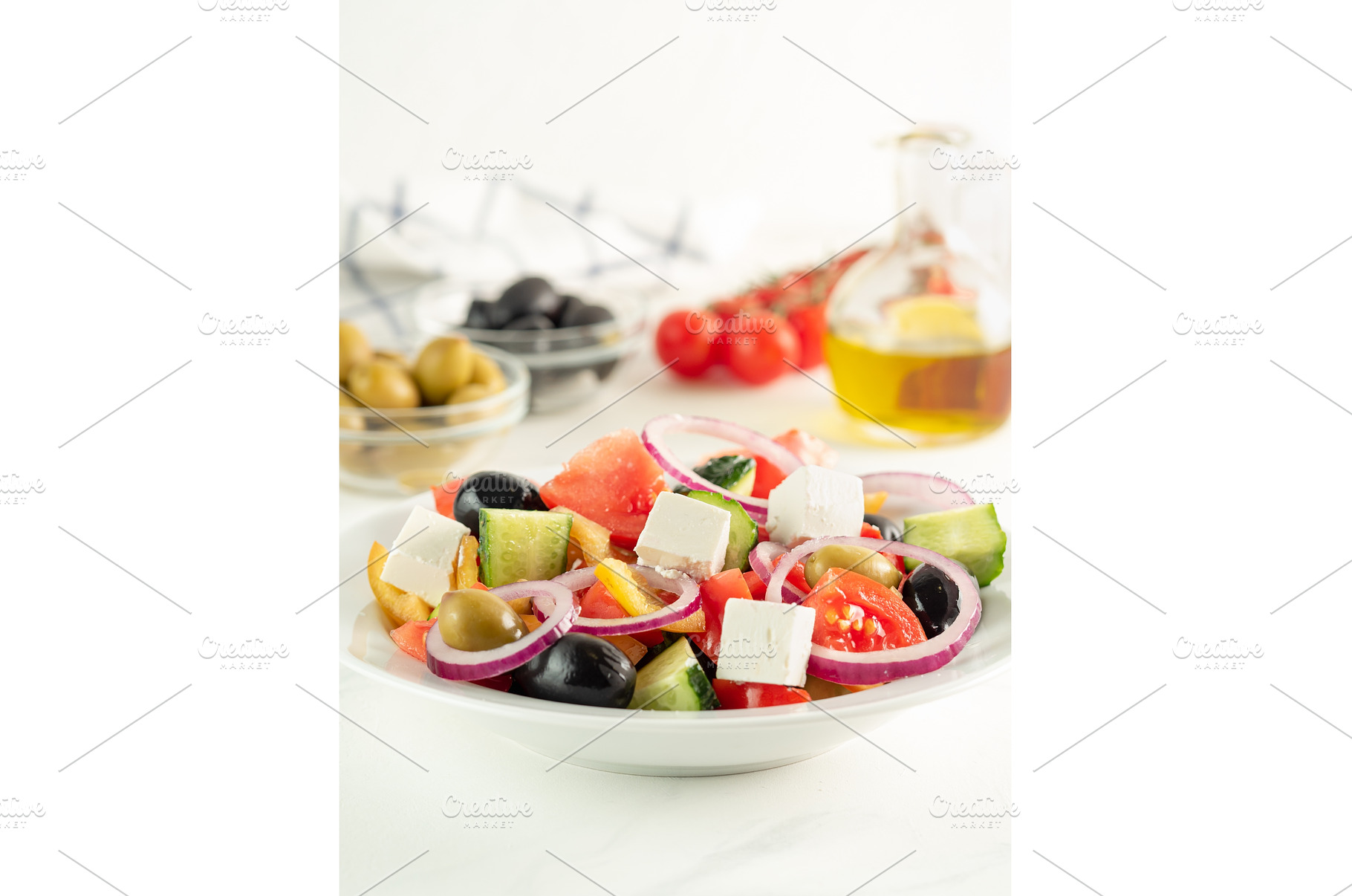 Greek salad on the table, vertical, a Food & Drink Photo by Fascinadora