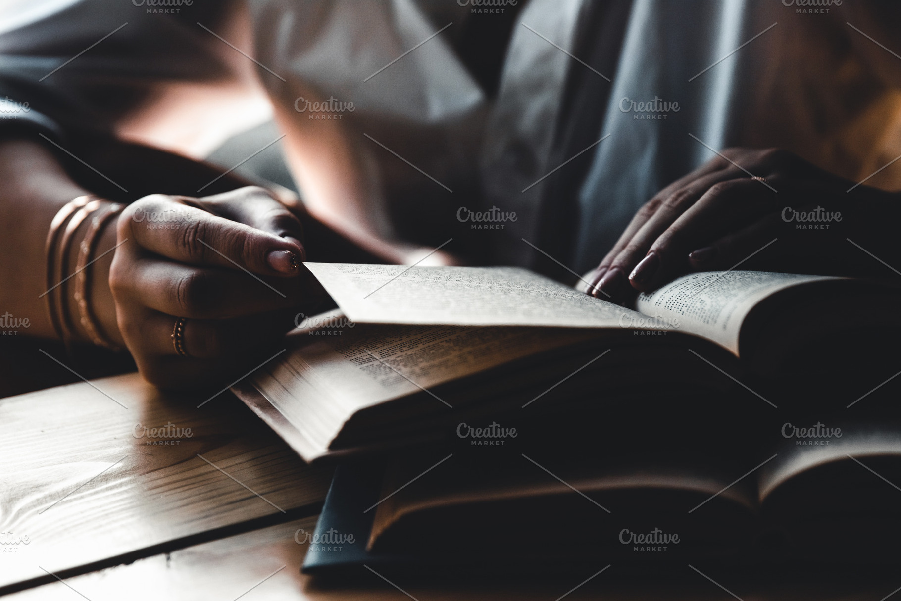 A woman is reading a book education featuring background, woman, and hand, a School & Education Photo by OS