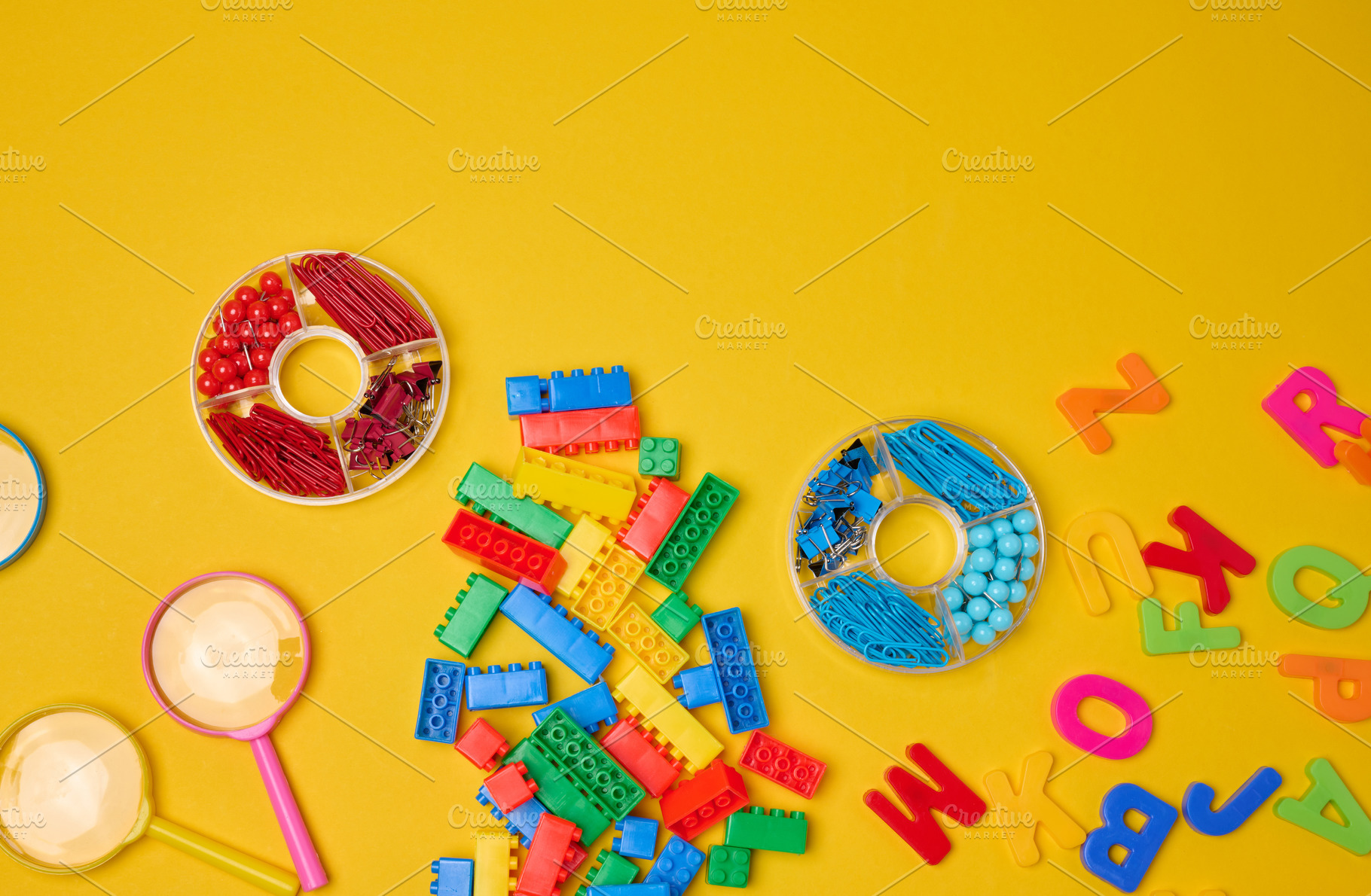 Vibrant collection of colorful school supplies, building bricks,, an Abstract Photo by ndanko