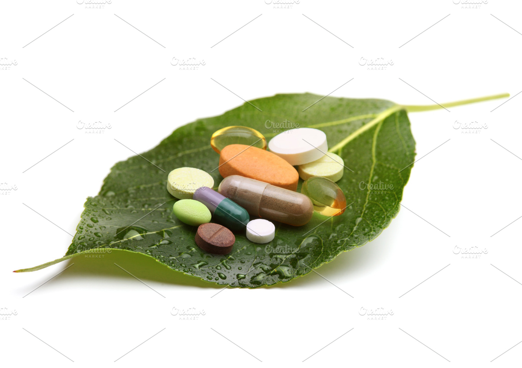 Vitamins tablets and pills on leaf stock photo containing antibiotic and, a Health & Medical Photo by Liliia Rudchenko