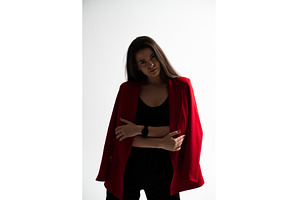 Confident young woman in a red, a Person Photo by volodymyrshtun13795