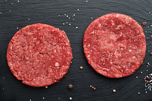 Fresh raw beef burger patties featuring beef, prime, and black angus