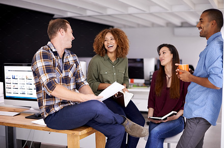 Teamwork holds the capacity for increased office morale, a Photo by Peopleimages.com
